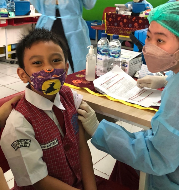 A student being vaccinated for the second time in the i-SERVE Vaccine program organized by PT. CPI and YCAB Foundation